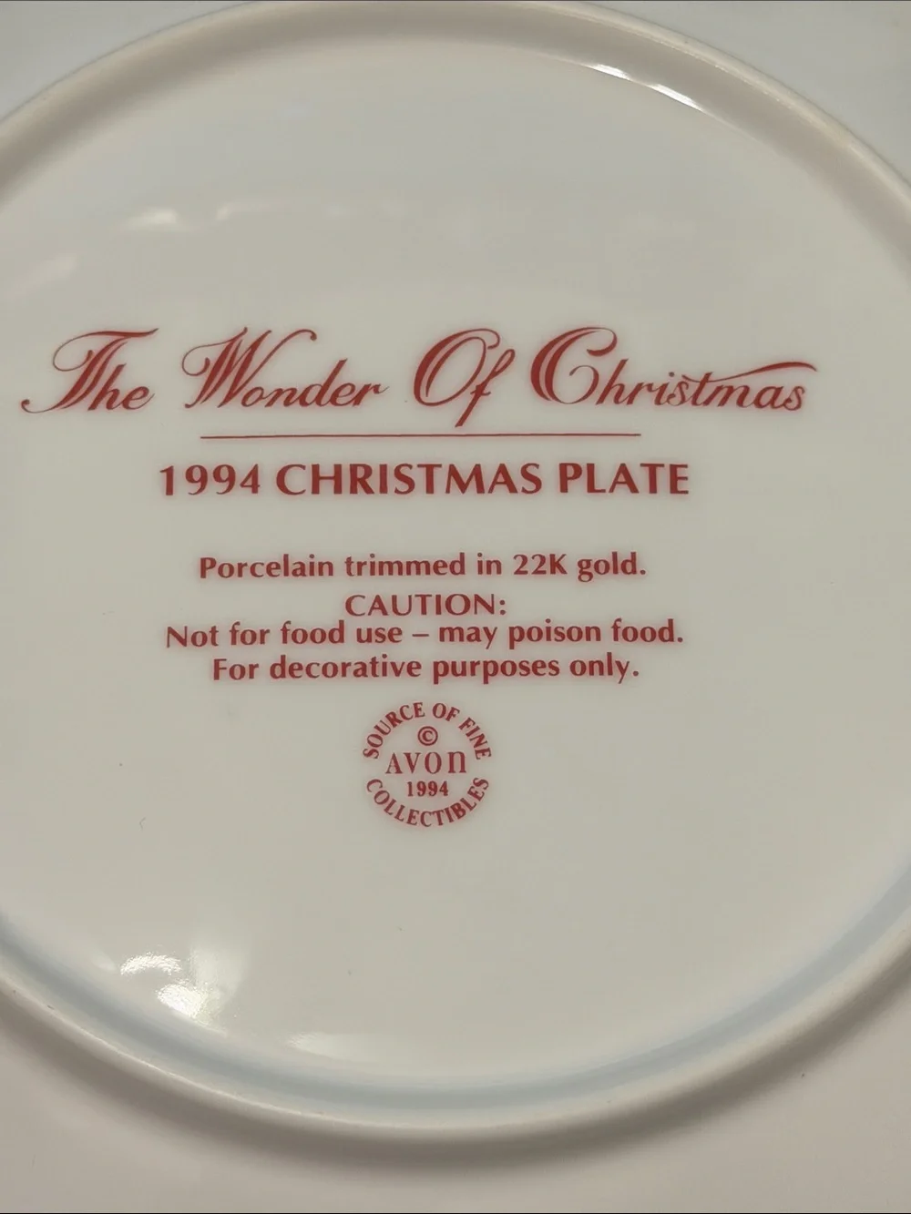 Avon 1994 Christmas Decorative Plate with Santa and Girl. 22K gold rim.
